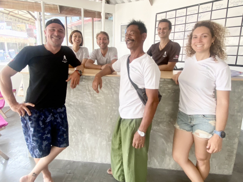 Smiling AquaTao team at the shop reception
