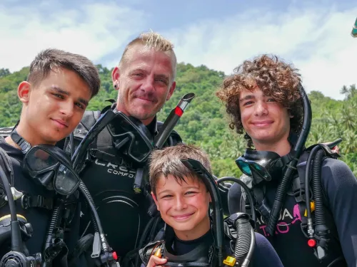 Instructor with a group of young divers